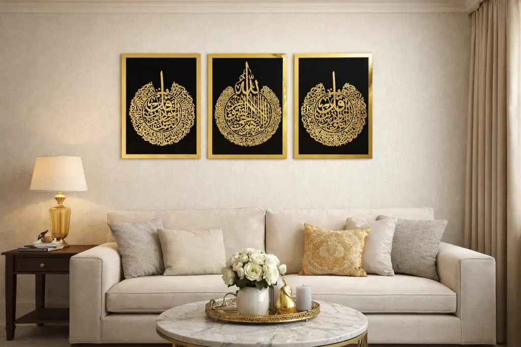 Modern 3-piece gold and black Quranic verse artwork by iwa concept above a beige sofa.