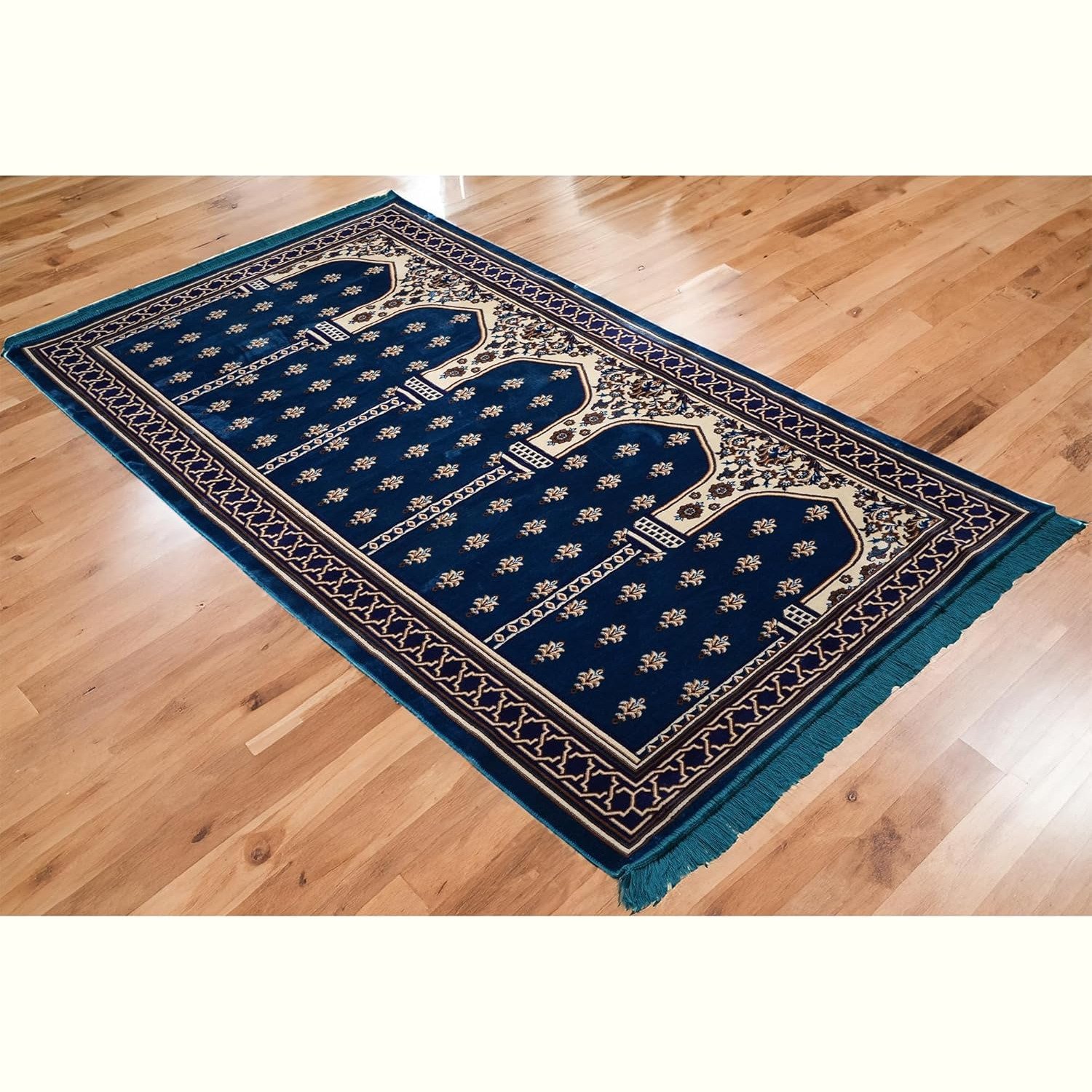 Blue Modefa muslim prayer carpet on wooden floor for group prayer