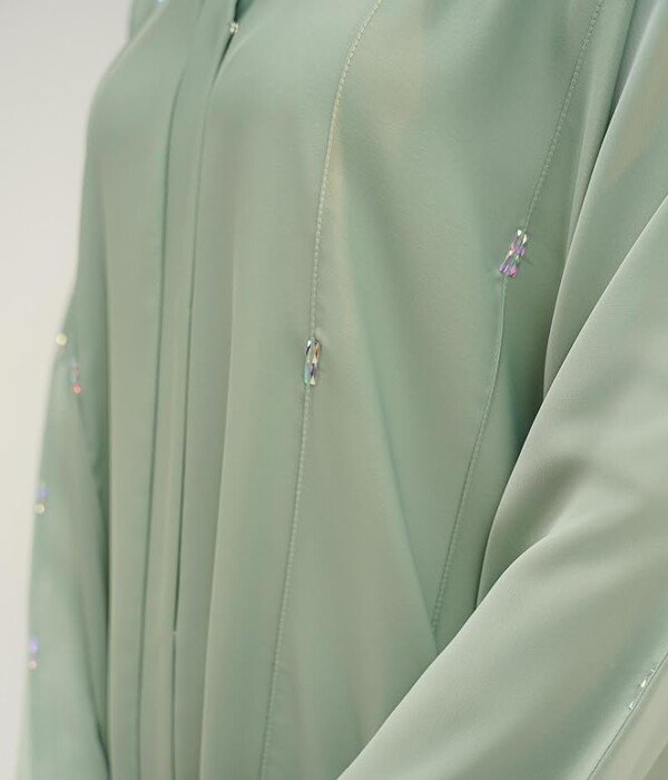 Beautiful details and premium fabric quality Silky drape and elegant stonework details on the modest Sage Green Maya Abaya